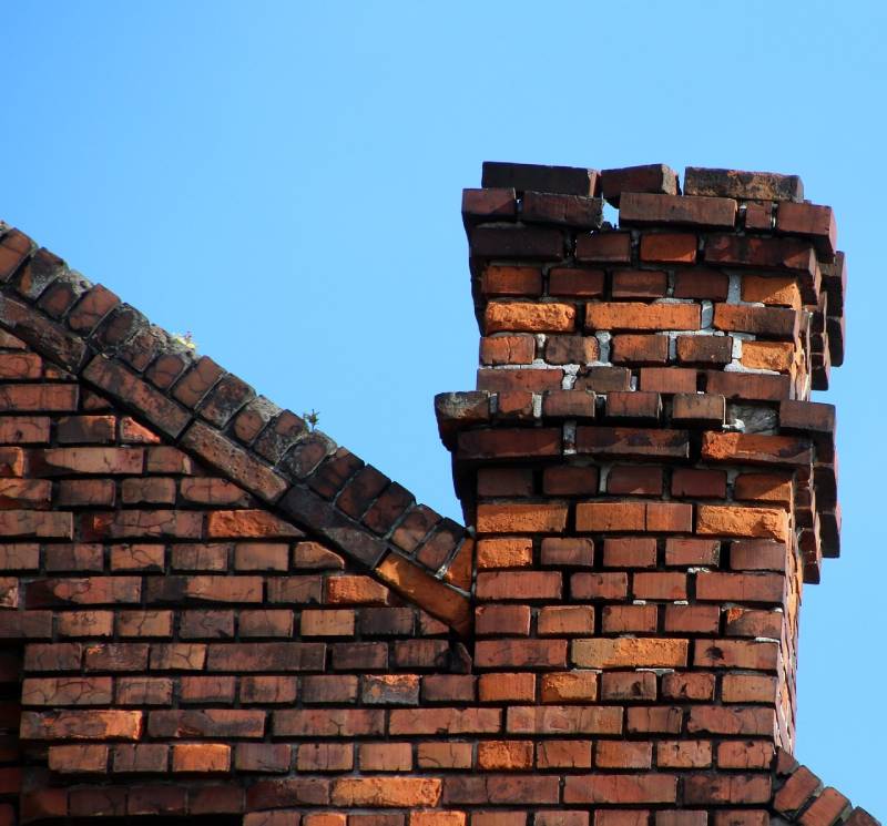 Damaged chimney on an Mira Mesa home showing cracks and missing mortar